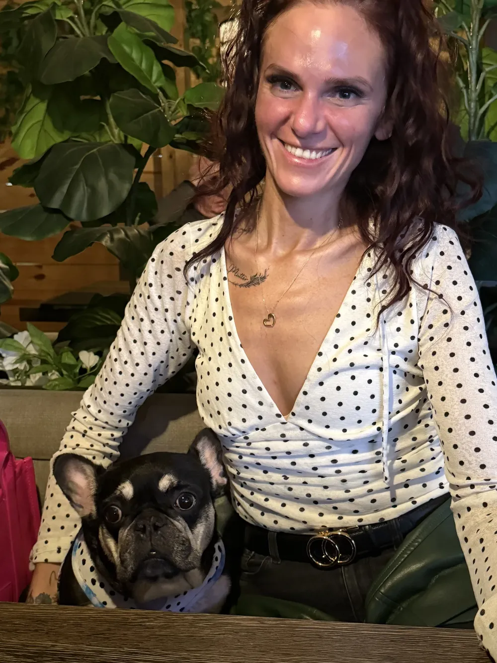 Meaghan smiling at her desk with Luna